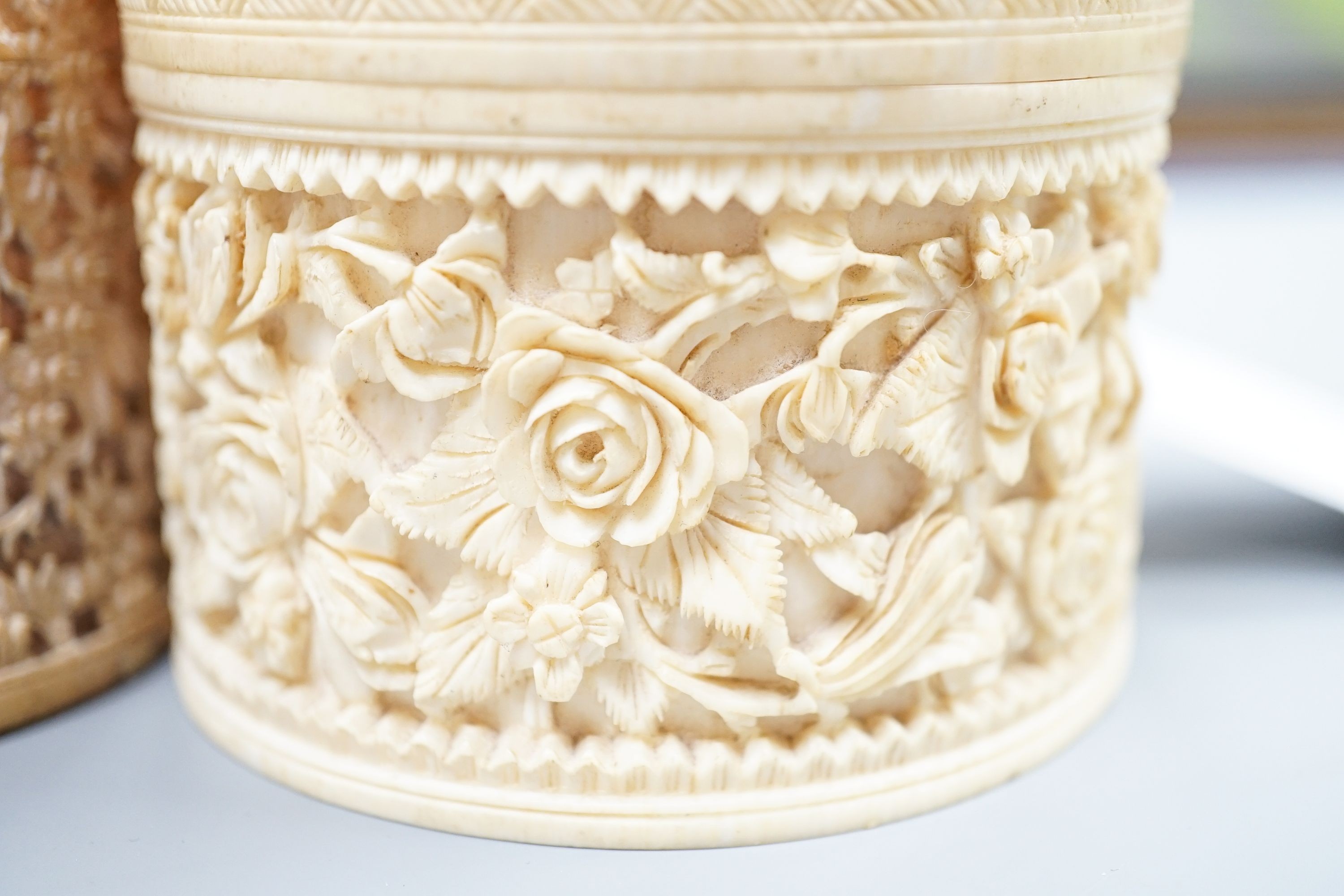 A pair of Chinese carved ivory pots and a Chinese ivory circular box and cover, 19th century